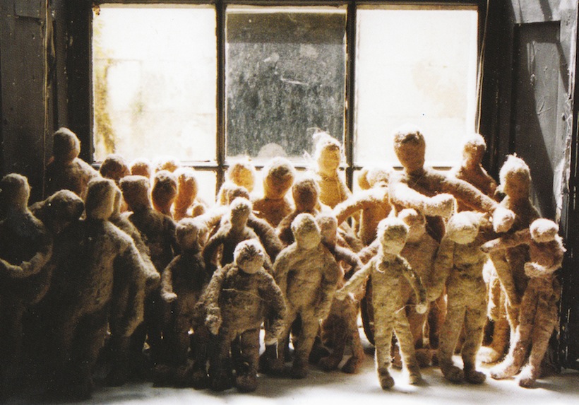 a group of felt figures in the window