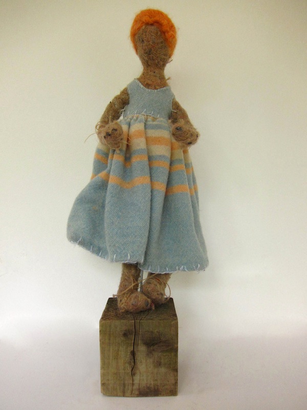 Doll in a blue dress with red hair