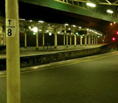 An empty train platform at night